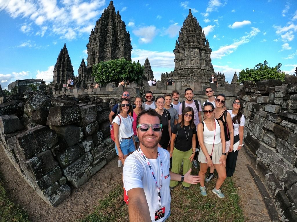 A group of WeRoaders taking a selfie in front of the Prambanan temple