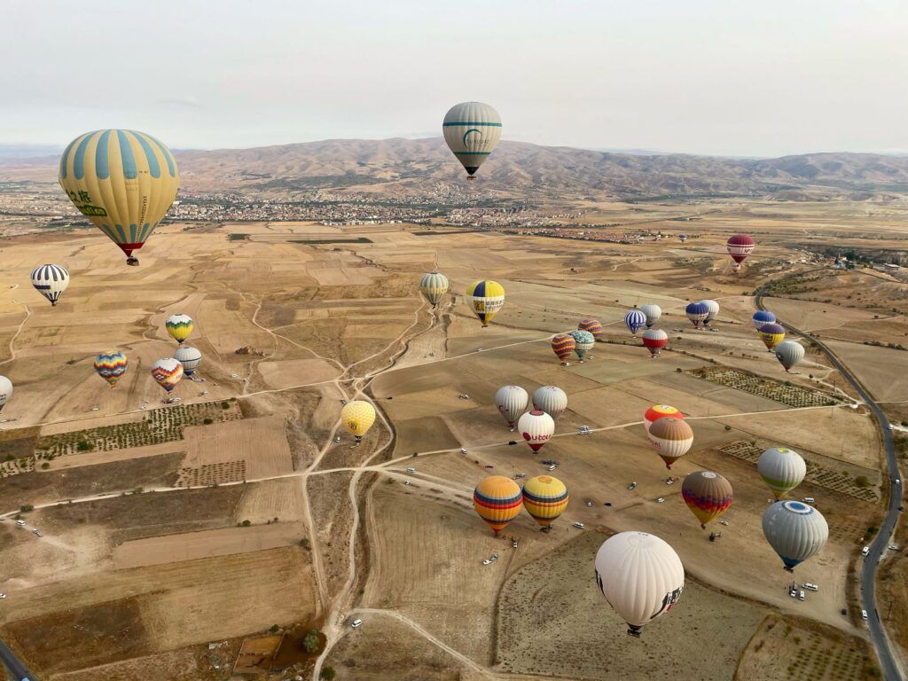 Colourful hot air balloons fly over Cappadocia