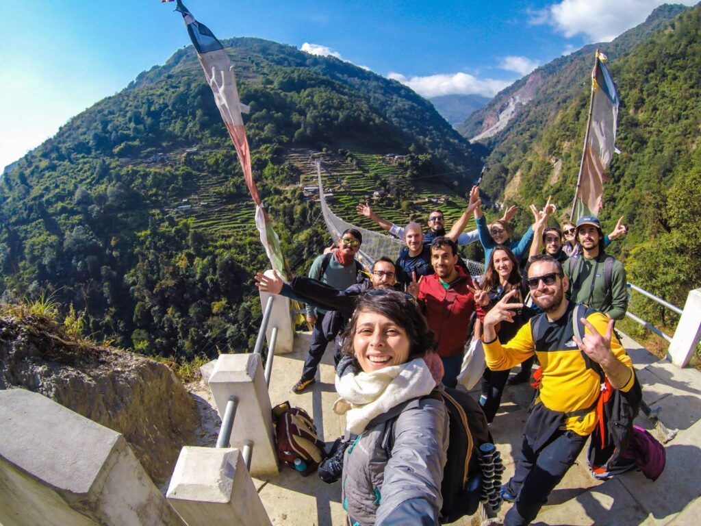 WeRoad travellers on a bridge at Ghandruk