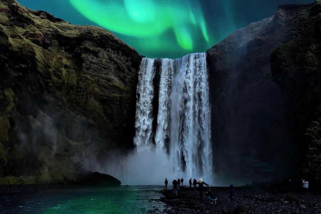 Northern Lights above a waterfall in Iceland