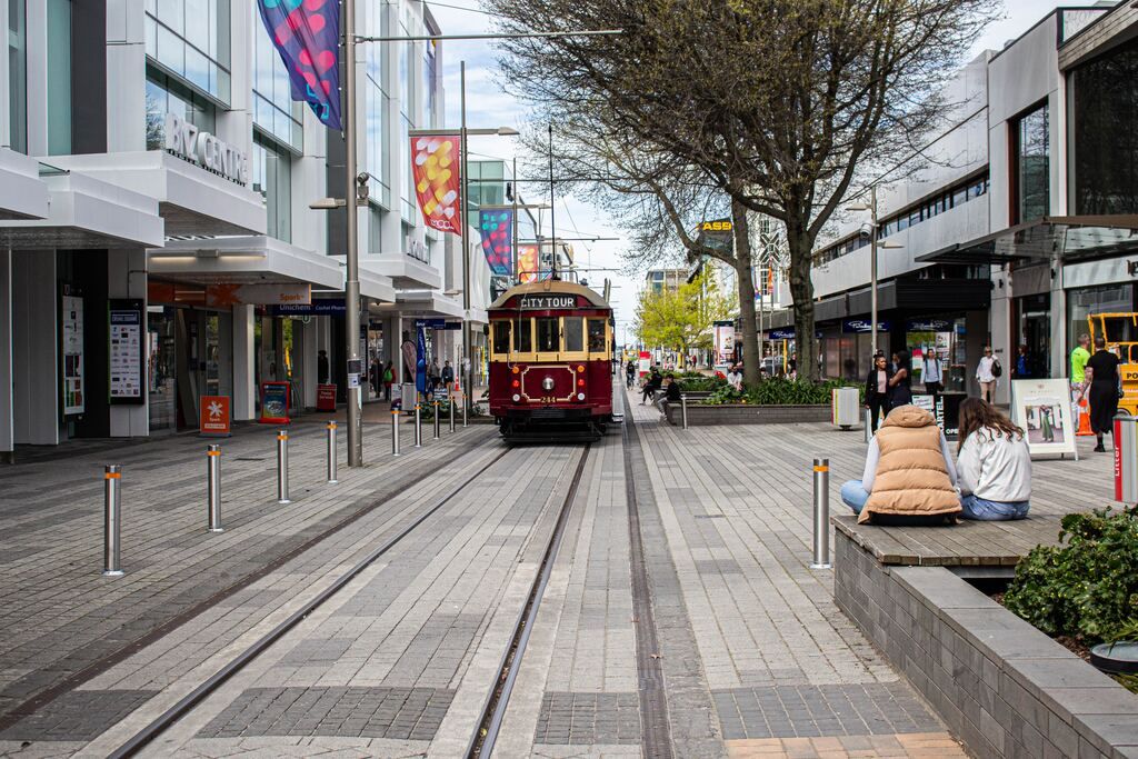 Tram passing through the city streets during the day