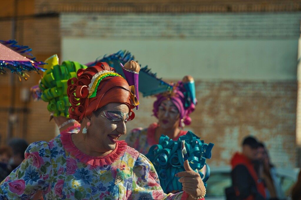 A group of people in colourful costumes dancing.
