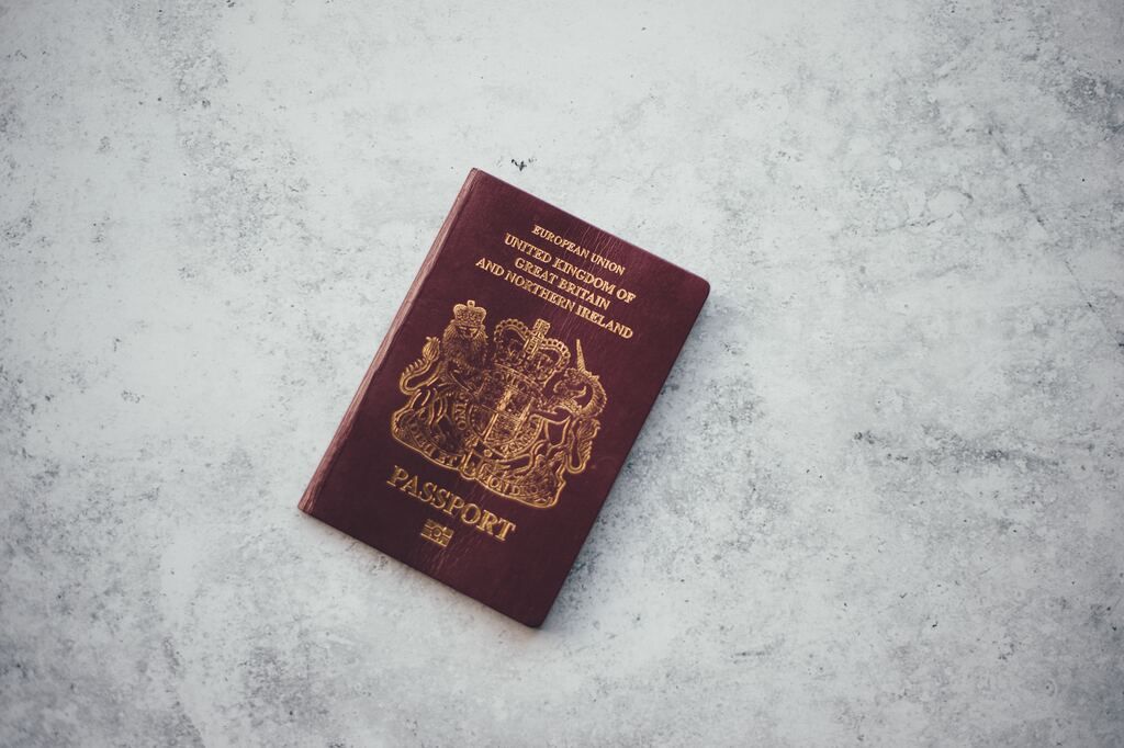 photo of a British passport, with a red cover and gold lettering