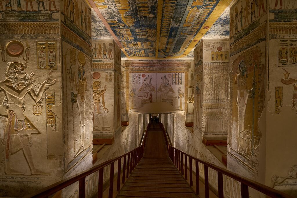a long corridor with paintings on the wall