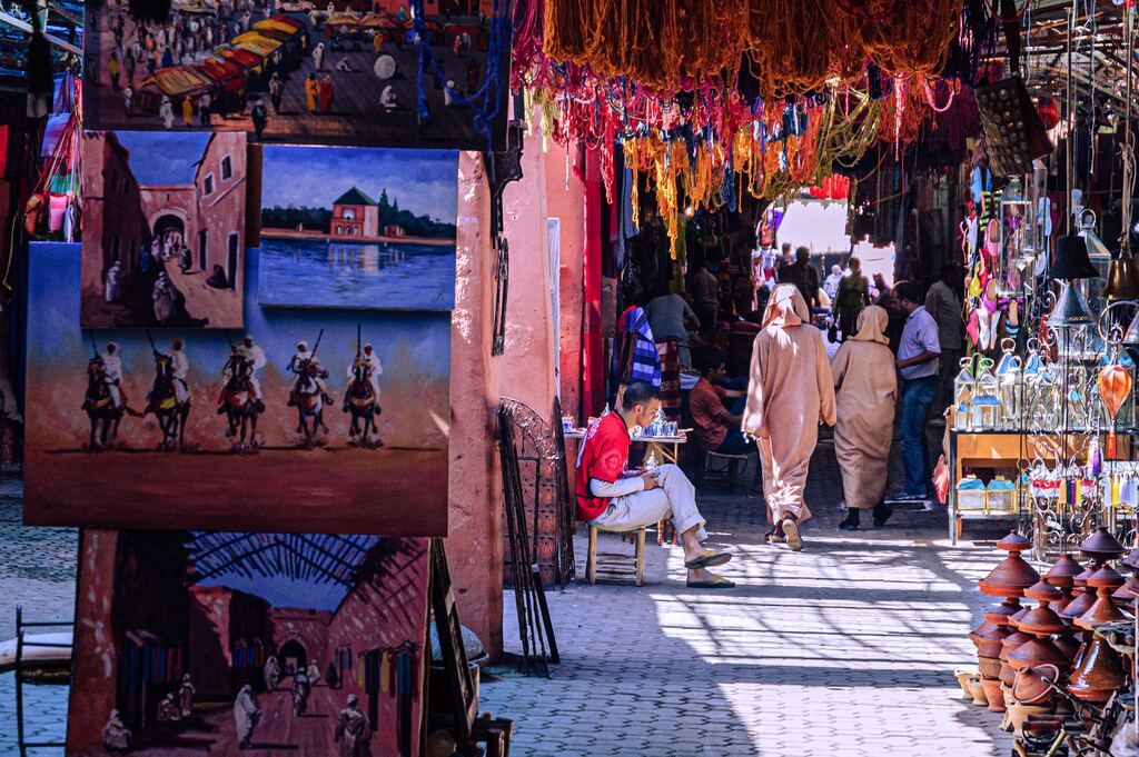 People walking in the street during the day in Marrakesh