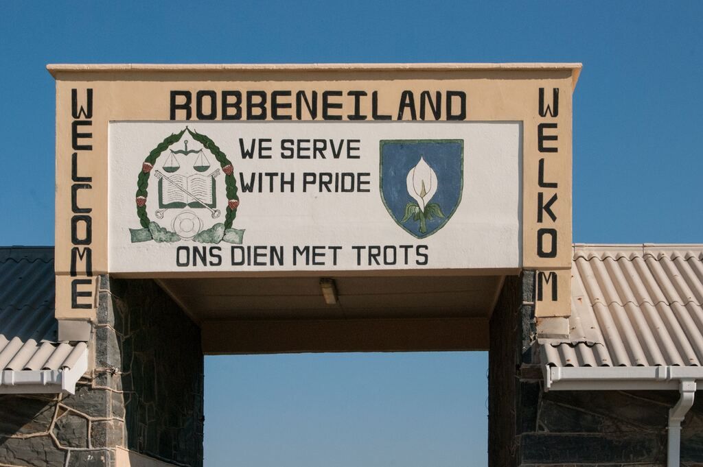 A sign that says Robben Island we proudly serve.