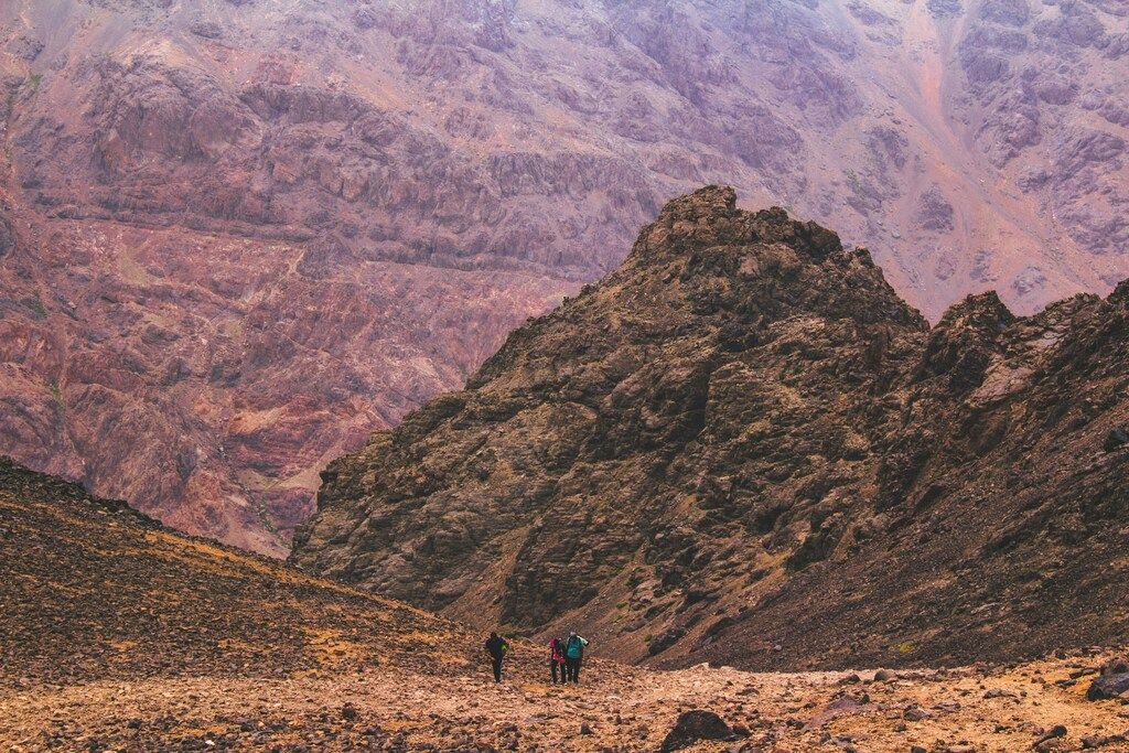Hikers tackling the rocky trails of Mount Toubkal in Morocco