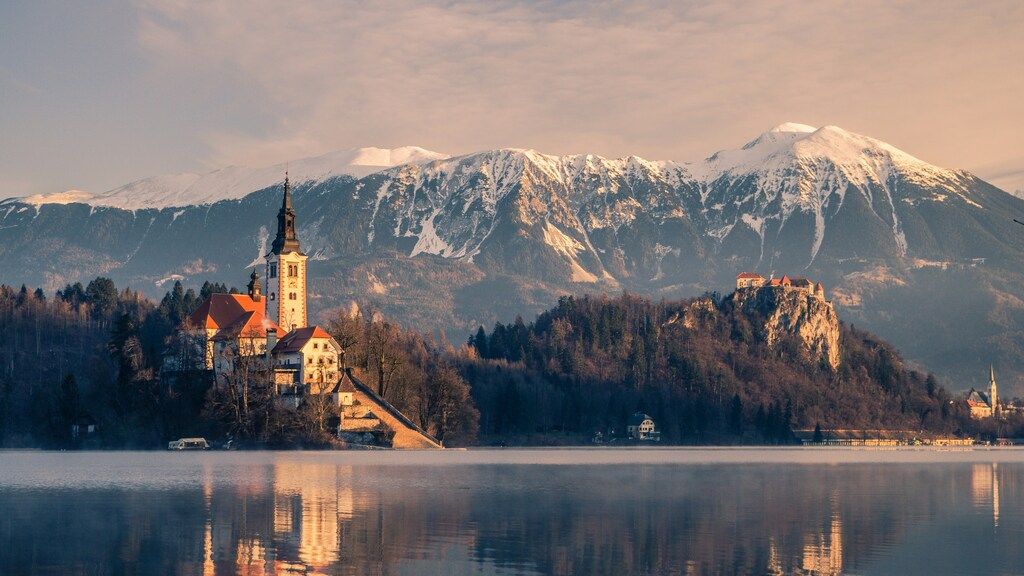 Lake Bled with its iconic church and the Julian Alps, Slovenia