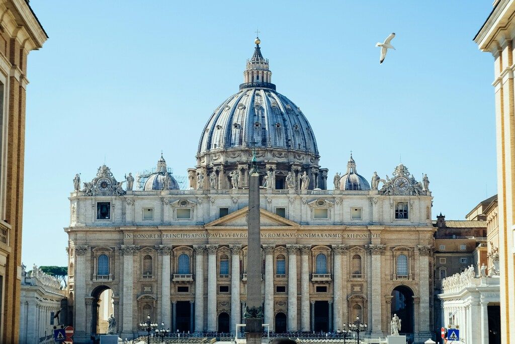 Frontal view of St. Peter's Basilica in Vatican City under a clear sky