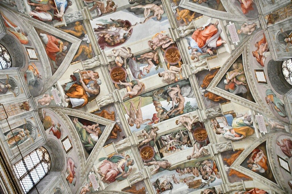 Close-up view of Michelangelo's intricate ceiling frescoes in the Sistine Chapel