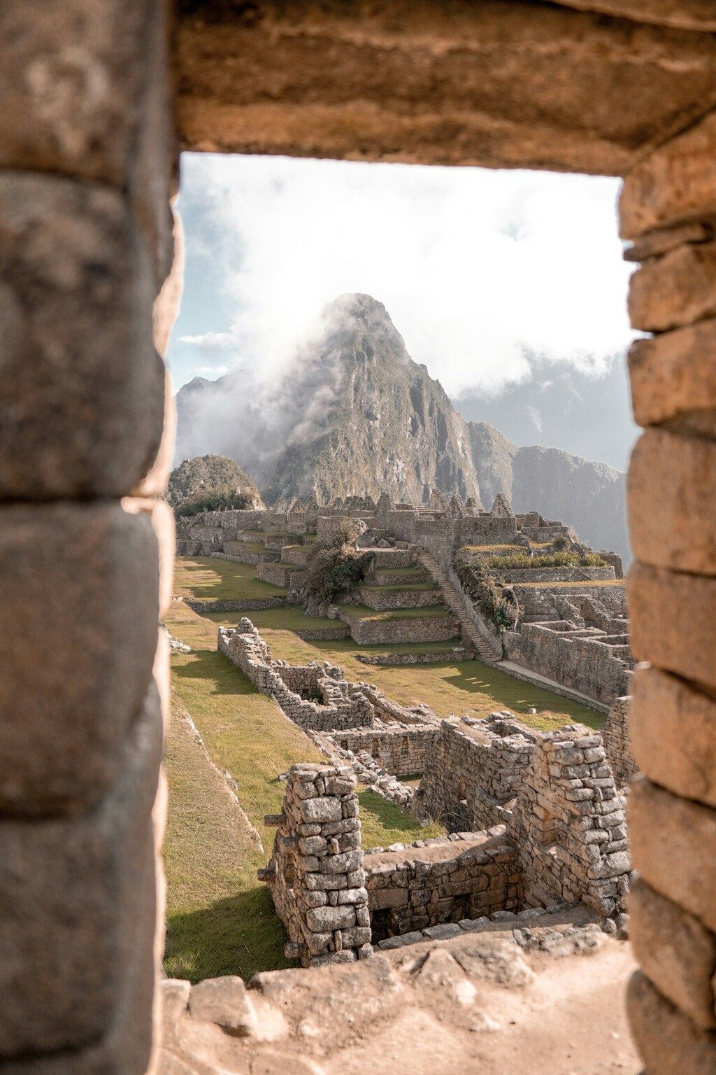 View of Machu Picchu framed by ancient stone structures