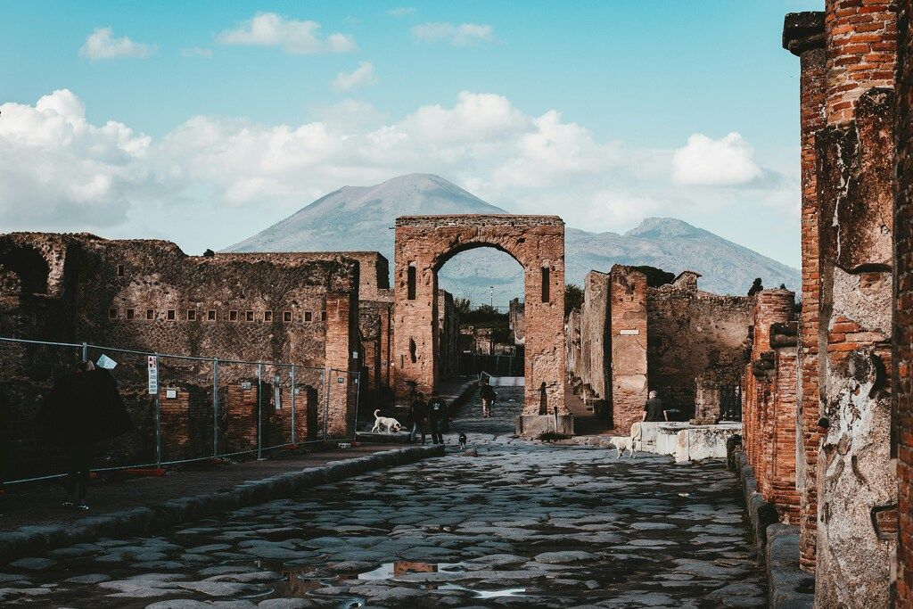 Ancient ruins of Pompeii with Mount Vesuvius in the background