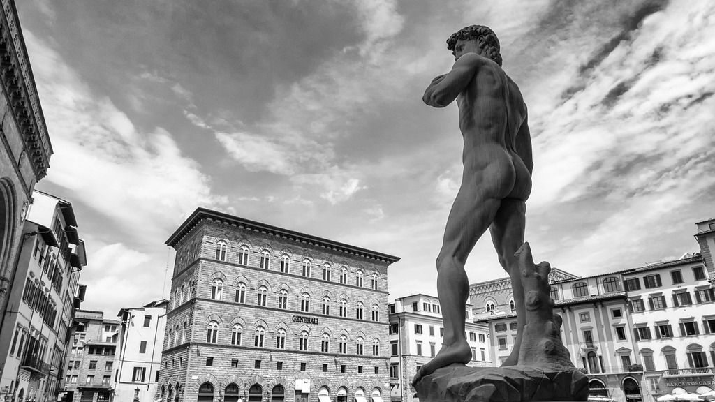 Black and white image of the statue of Michelangelo's David in Piazza della Signoria, Florence, Italy.