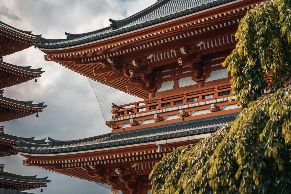 Architectural details of a traditional Japanese temple with intricate wooden designs.