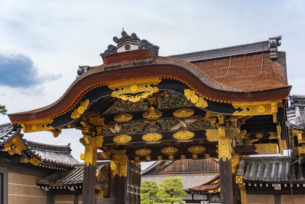 Detailed golden gate entrance at Nijō Castle in Kyoto.